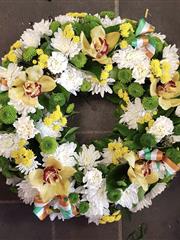 Green white and gold wreath