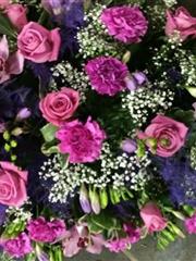 Pink and purple double ended casket spray 