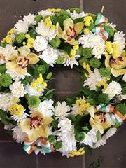 Green white and gold wreath