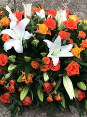 Autumnal rose and Lilly double ended casket spray 