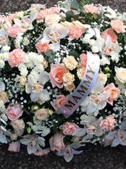 Peaches and cream double ended casket spray