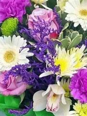Florist choice in lilac lime green and creams in box