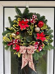 Luxury Christmas door wreath with baubles and ribbon 