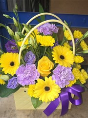 Handbag arrangement in purples and yellows 